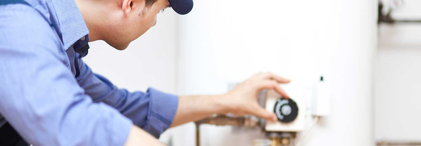 Technician repairing an hot-water heater
